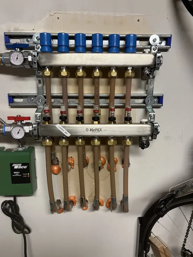 Plumber performing Water Heater Repair at a residential property in Yankee Springs